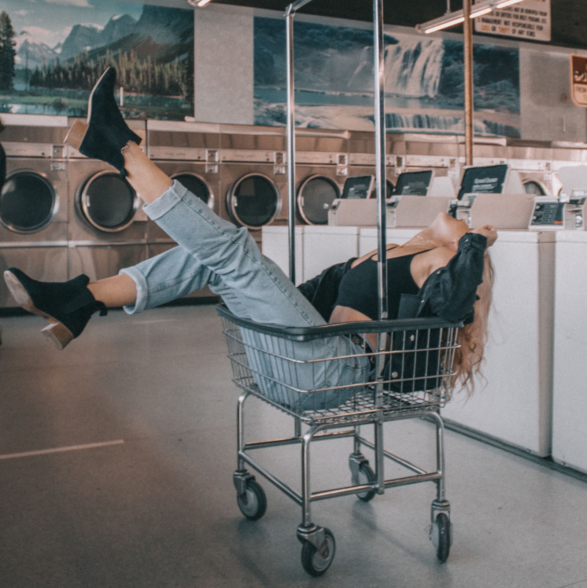 girl reclining in laundry basket